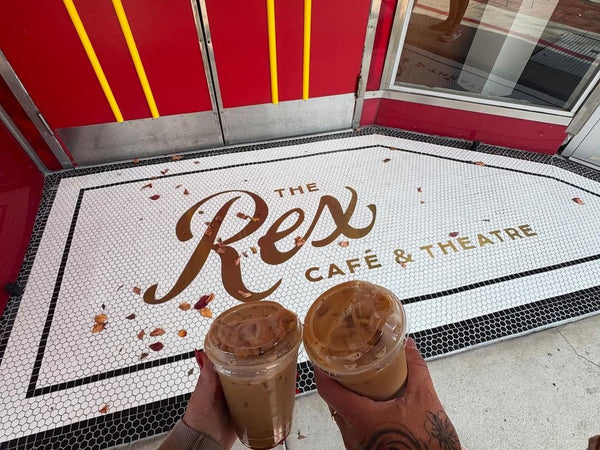 The Rex Cafe and Theatre entrance mosaic with gold metal script lettering