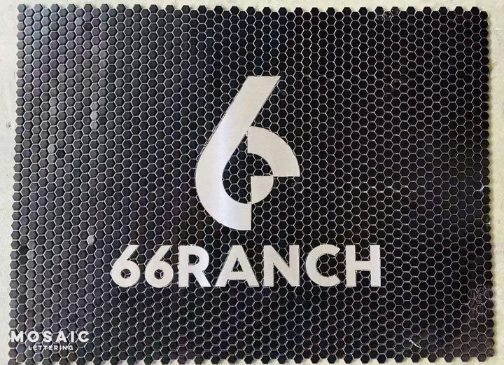 66 Ranch black hexagon logo mosaic, business logo mosaic by Mosaic Lettering, photographed at our studio before installation