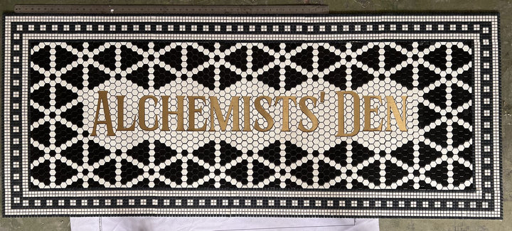 Alchemists' Den patterned lettering mosaic, bar logo mosaic by Mosaic Lettering, photographed at our studio before installation