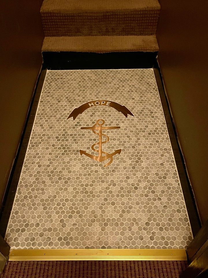 Gold metal monogram on marble mosaic, house number mosaic by Mosaic Lettering