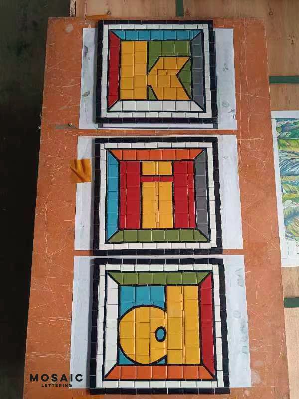 Colourful letter tile mosaic, hand-cut mosaic by Mosaic Lettering, photographed at our studio before installation