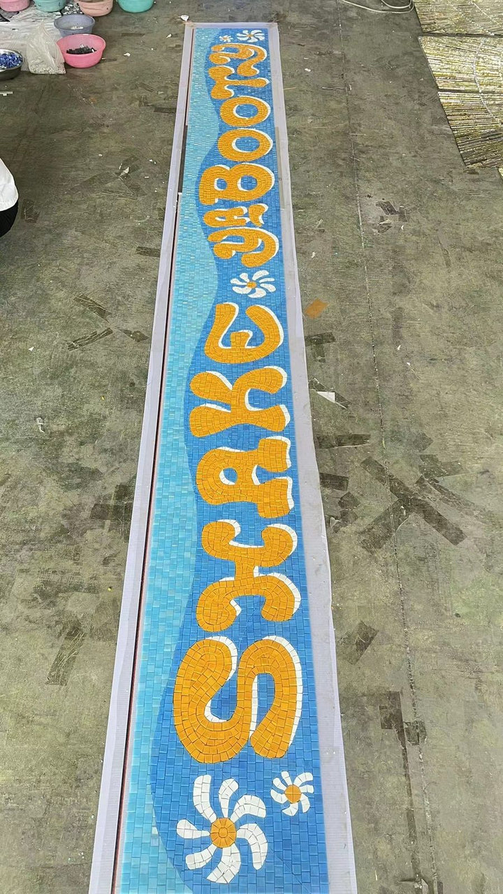 Colourful lettering mosaic in production, restaurant logo mosaic by Mosaic Lettering