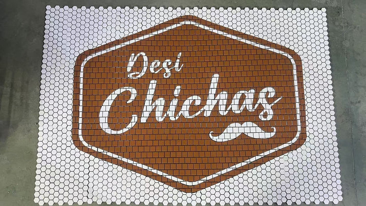 Desi Chichas logo mosaic, restaurant logo mosaic by Mosaic Lettering, photographed at our studio before installation