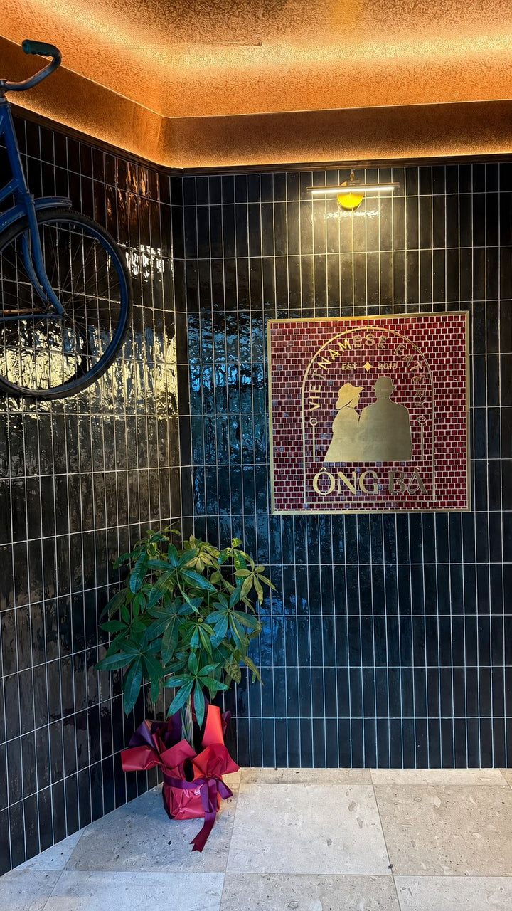 Design concept: wall-mounted logo mosaic at a shop entrance