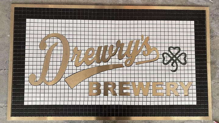 Drewry's Brewery gold script mosaic, bar logo mosaic by Mosaic Lettering, photographed at our studio before installation