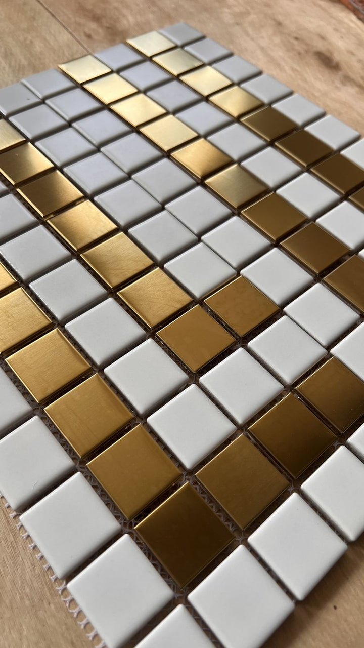 Gold metallic and white tile detail, gold metal lettering mosaic by Mosaic Lettering, photographed at our studio before installation