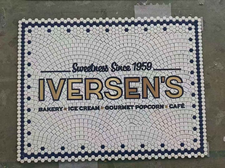 Iversen's bakery logo mosaic, restaurant logo mosaic by Mosaic Lettering, photographed at our studio before installation