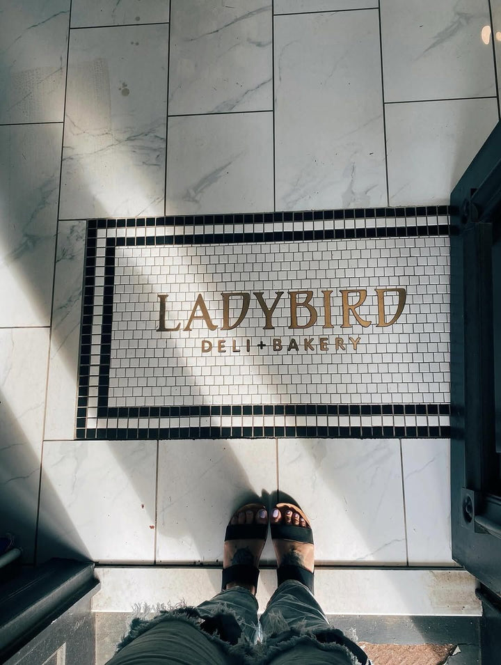Ladybird Delicatessen mosaic, restaurant logo mosaic by Mosaic Lettering