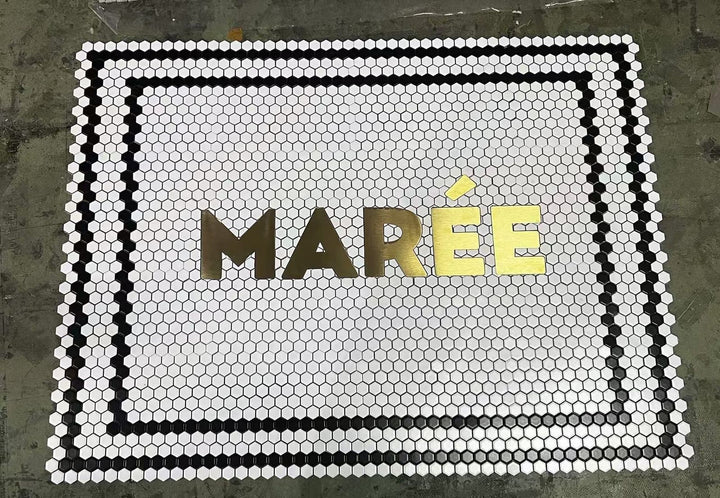 Marée gold lettering mosaic with border, restaurant logo mosaic by Mosaic Lettering, photographed at our studio before installation