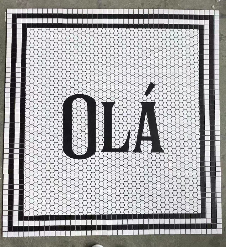 Olá bold lettering mosaic, restaurant logo mosaic by Mosaic Lettering, photographed at our studio before installation