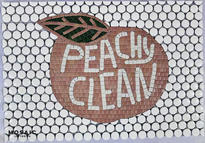 Peachy Clean peach logo mosaic, business logo mosaic by Mosaic Lettering, photographed at our studio before installation
