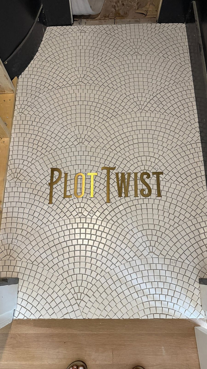Plot Twist gold lettering entrance, business logo mosaic by Mosaic Lettering