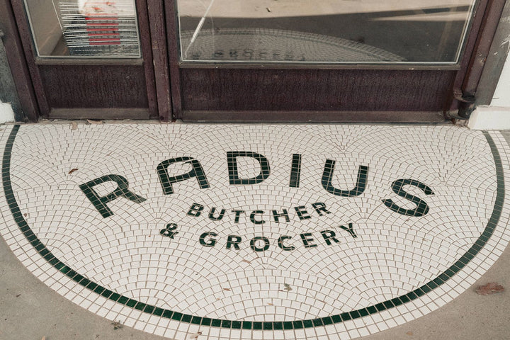 Radius Butcher & Grocery curved entrance mosaic, restaurant logo mosaic by Mosaic Lettering