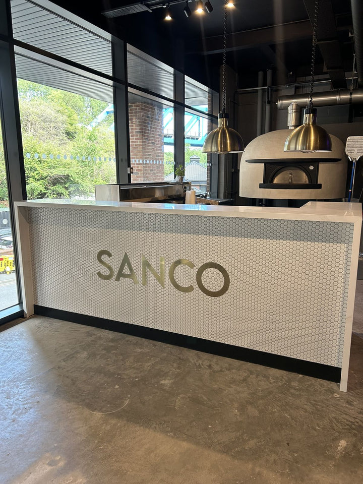 Sanco lettering on bar counter mosaic, bar logo mosaic by Mosaic Lettering