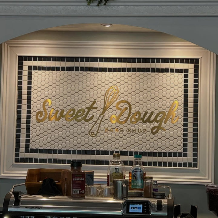 Sweet Dough gold script backsplash, restaurant logo mosaic by Mosaic Lettering