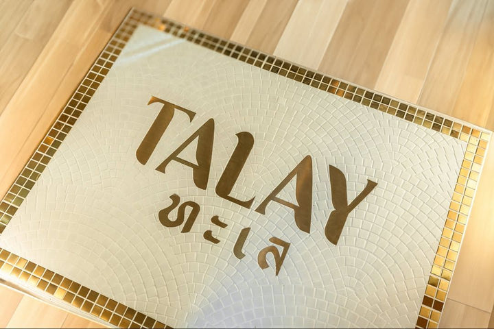 Talay gold lettering on white mosaic, restaurant logo mosaic by Mosaic Lettering
