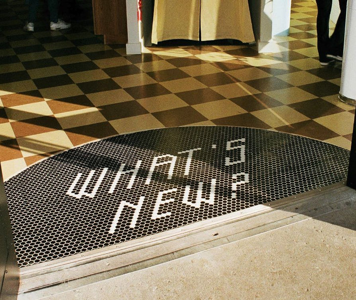 What's New? checkerboard entrance, business logo mosaic by Mosaic Lettering