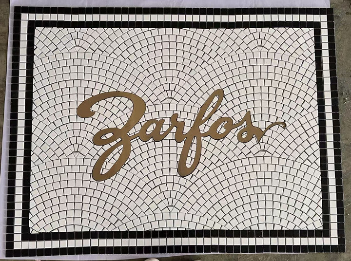 Zarfos gold script mosaic, business logo mosaic by Mosaic Lettering, photographed at our studio before installation